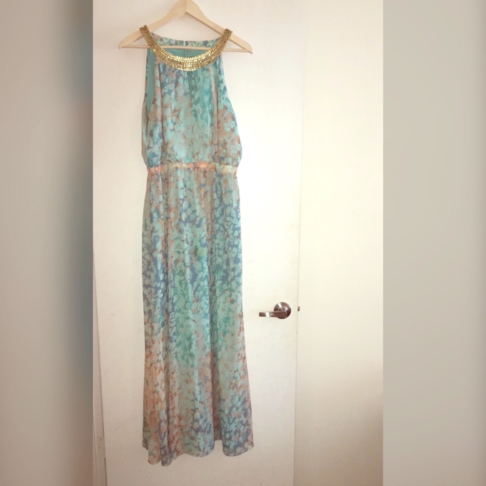 Dress with gold color stones around the neck